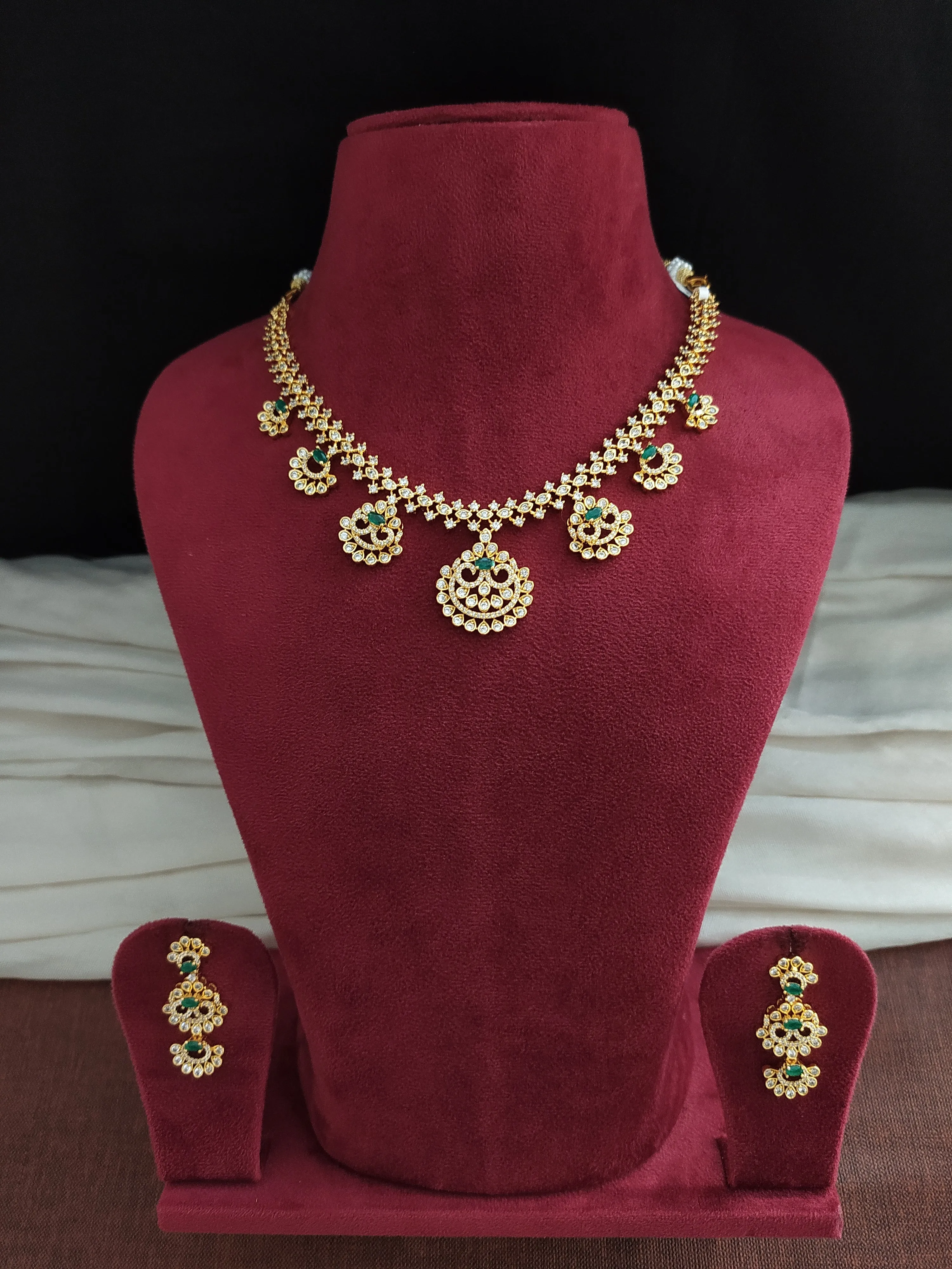 Alluring Necklace Set With Zircon Stones (Green, Red & White)